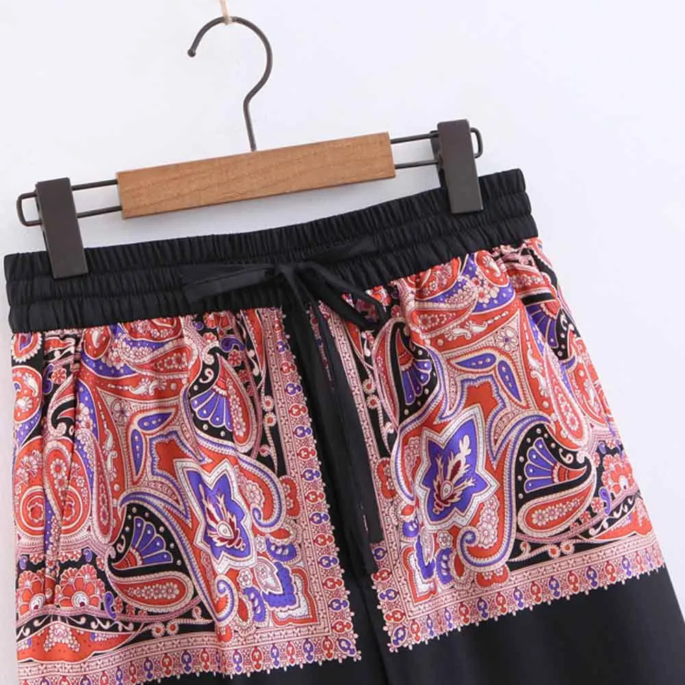 Винтажные прямые брюки контрастных цветов с цветочным принтом кешью и карманами