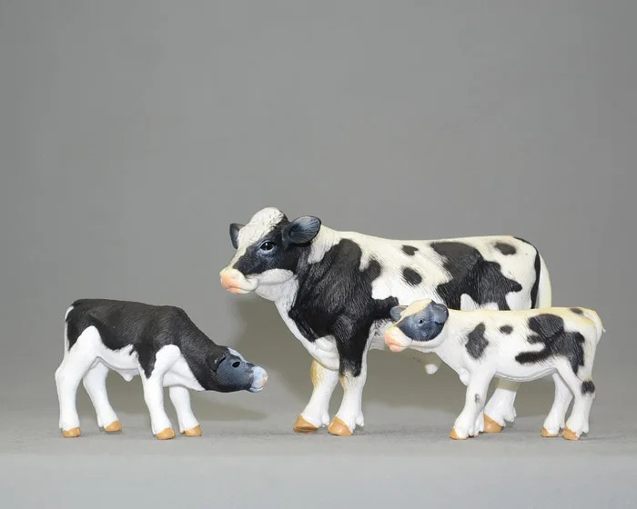 

Animas ! solid animal model toy black and white cow calf