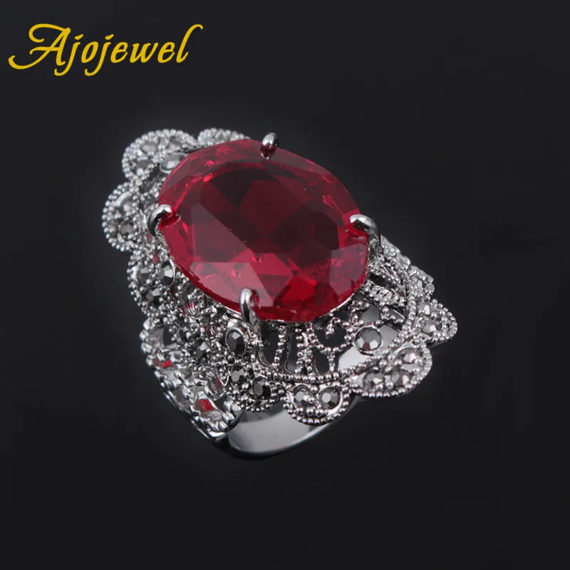 Женское кольцо с красным камнем Ajojewel черные стразы полыми цветами и