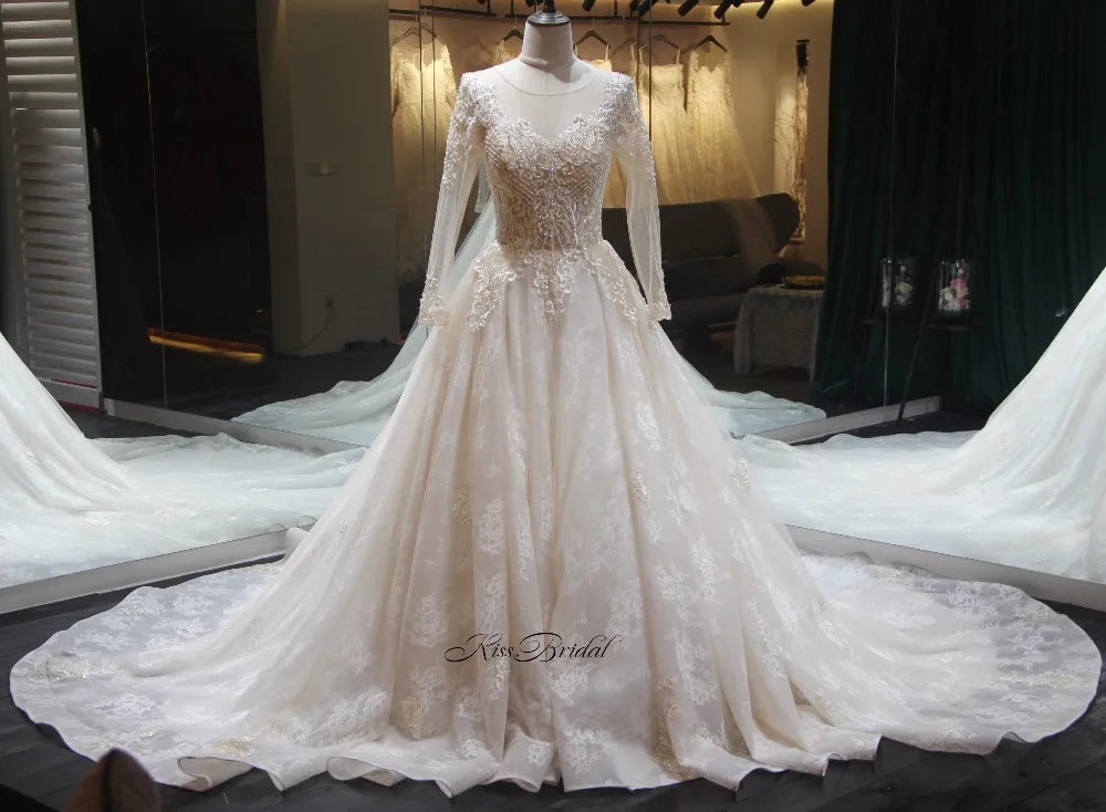 

Великолепное новое длинное свадебное платье 2018 с длинным рукавом трапециевидной формы с длинным шлейфом с аппликацией из кружева и тюля Св...