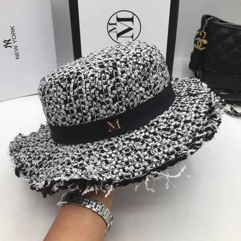 Fashion flat-topped hat black and white knitting small letters fashion tassel wide brim British vantrend men women |