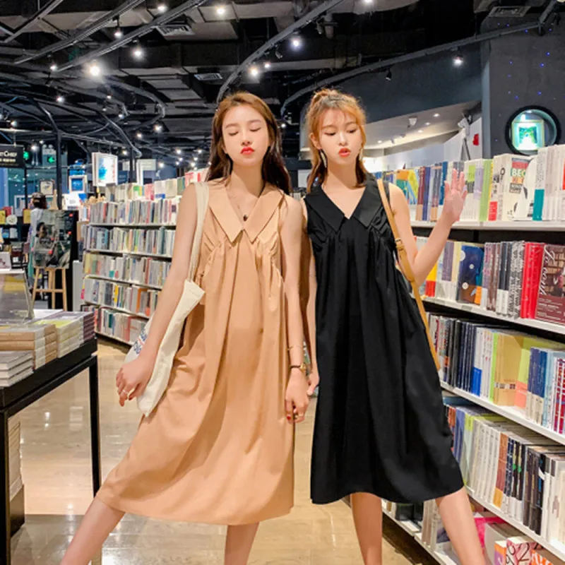 Женское платье без рукавов в стиле ретро с кукольным воротником черное цвета