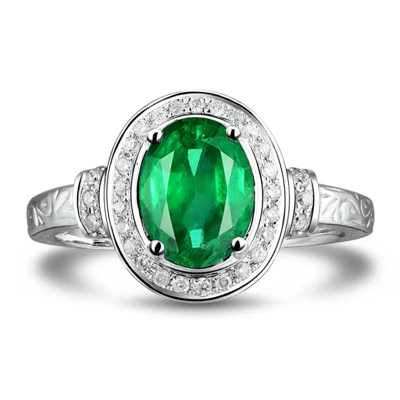 Кольца из белого золота с изумрудами и бриллиантами 14 к овальной огранки 7x9 мм