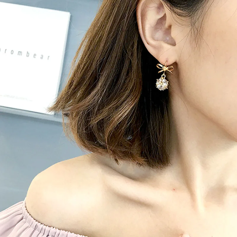 European and American fashion long bow copper material women's ear nail party earrings