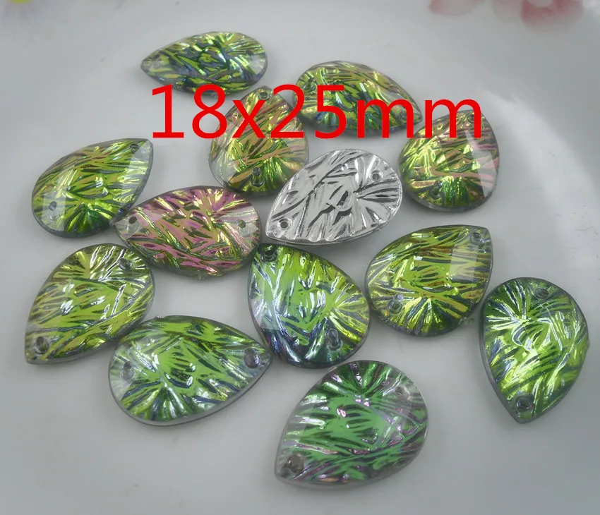 Аппликация для одежды из 20 штук акриловых кристаллов с разноцветными каплями воды, фасетированными гранями и серебристой основой с рельефным рисунком. Можно пришить.