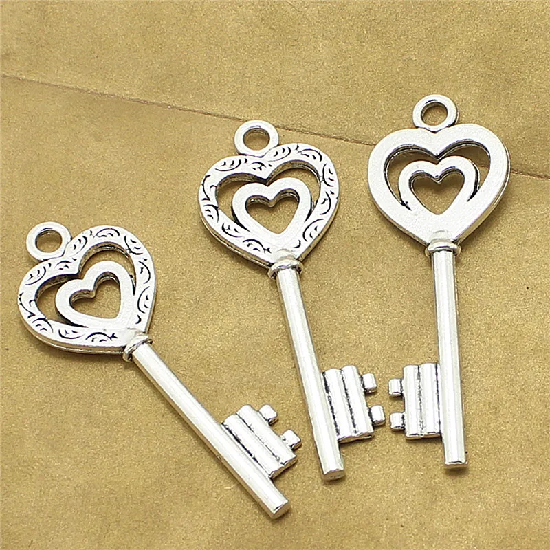 

Sweet Bell 15pcs 19*52mm Antique Metal Zinc Alloy Trendy key shaped charm Lovely Hearts Keys Jewelry Charms Pendant D1096