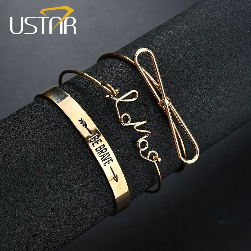 Женский браслет с надписью USTAR LOVE BE BRAVE открытый бант золотого цвета 3