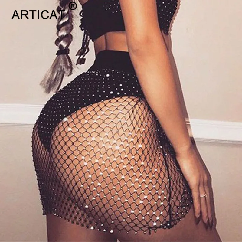

Articat Crystal Hollow Out Sexy Beach Summer Skirts Women Rhinestones Fishnet Bodycon Mini Skirt Casual See Through Party Skirt