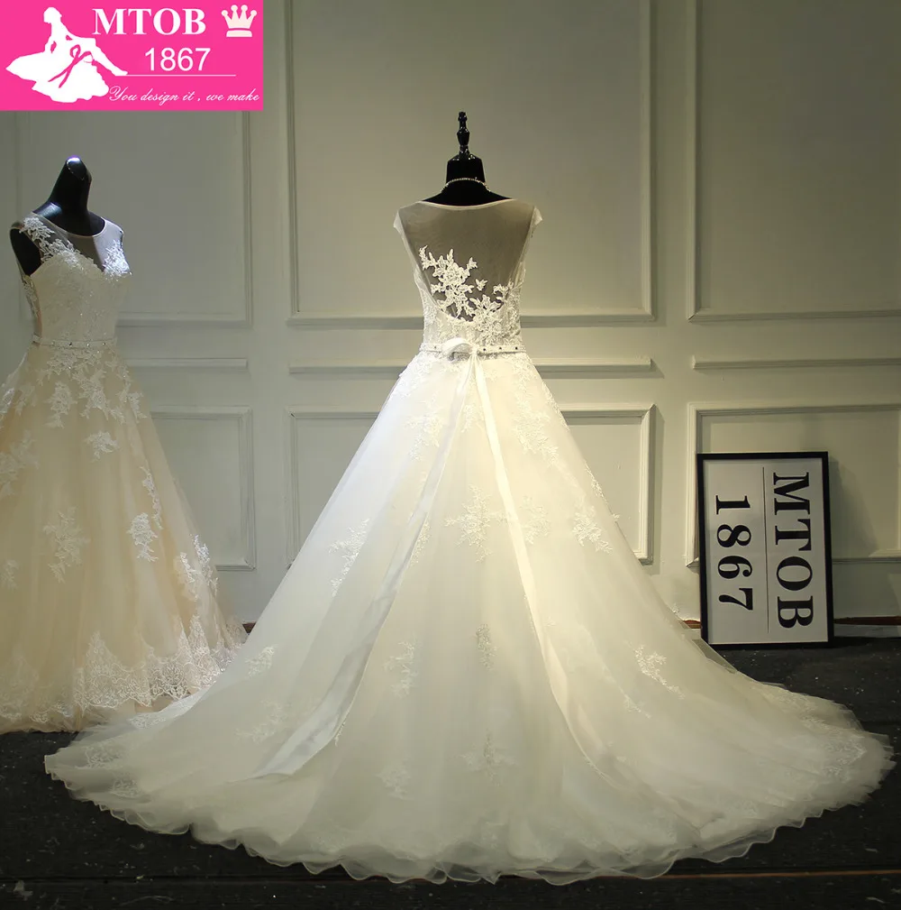 Кружевное свадебное платье трапециевидной формы романтичное без спинки