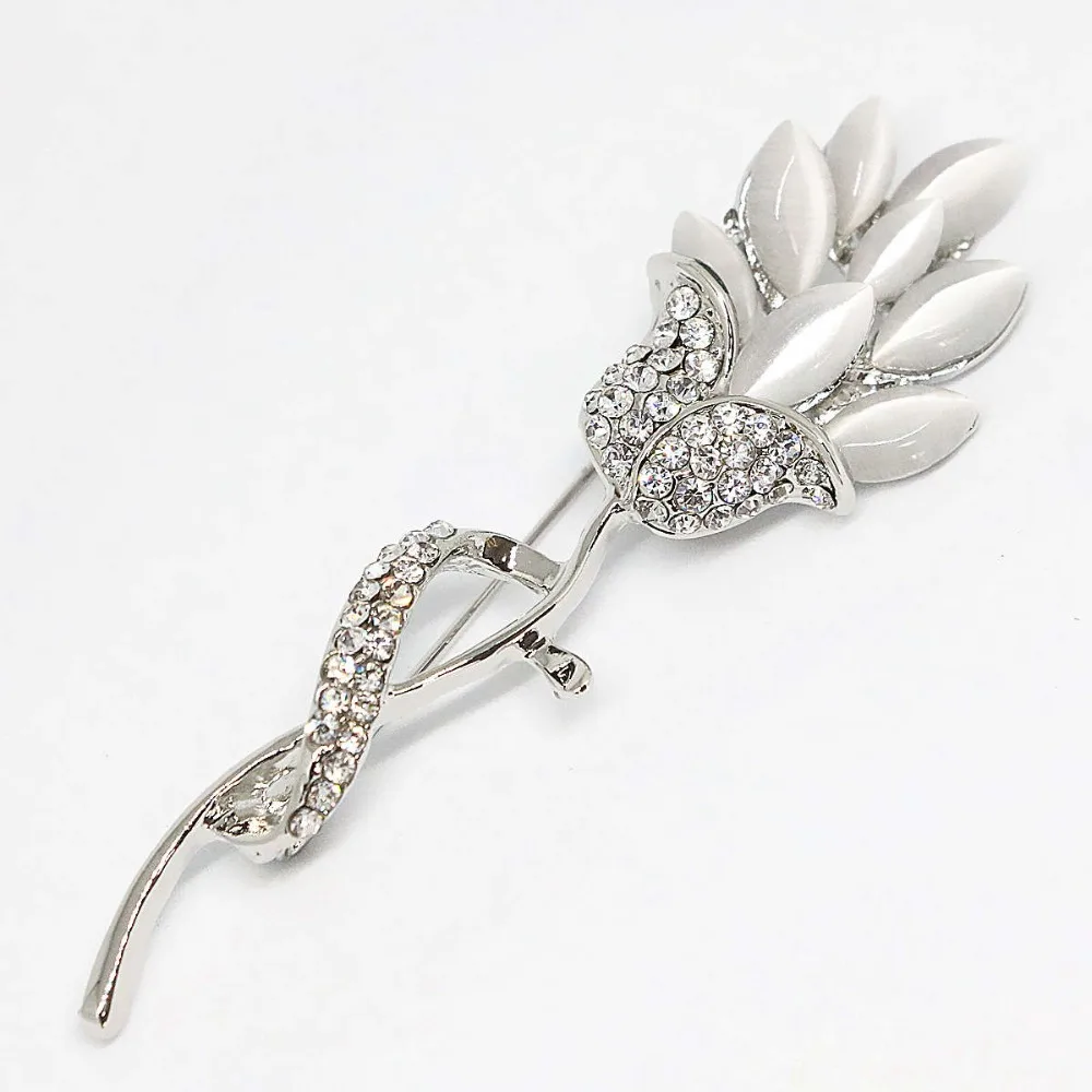 Брошь с длинным цветком белые хрустальные цветные кошачьи глаза изысканные