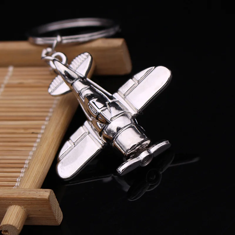 Милый серебряный самолет летательного искусства искусственный боевой подарок