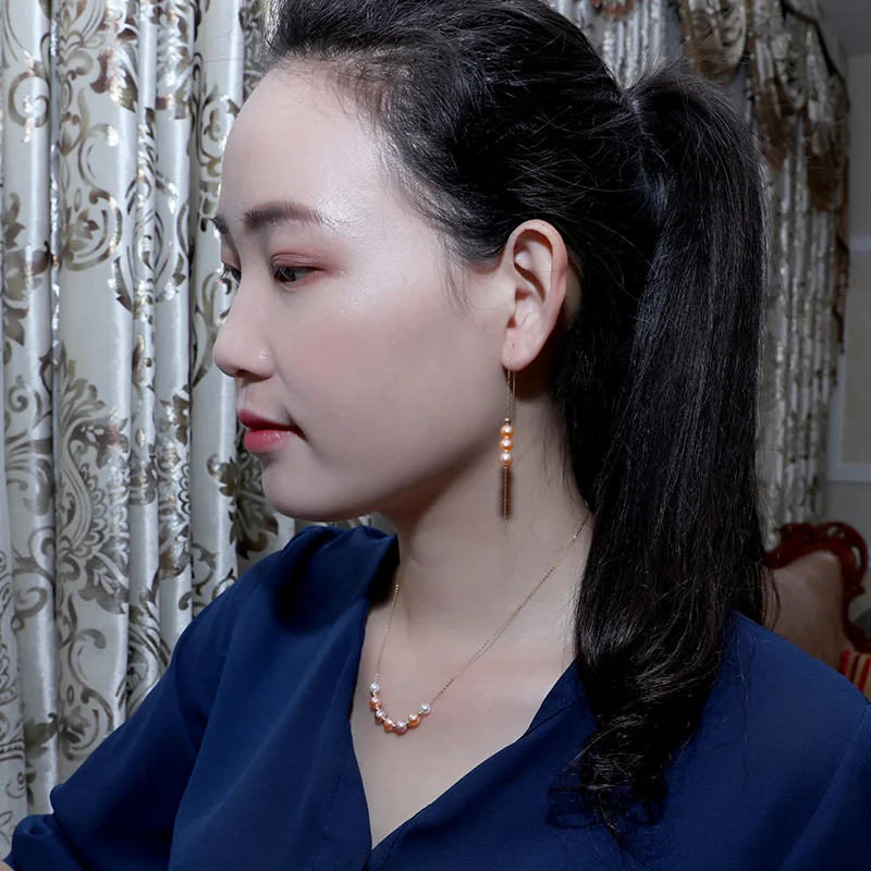 Серьги подвески из 18 каратного золота с натуральным пресноводным