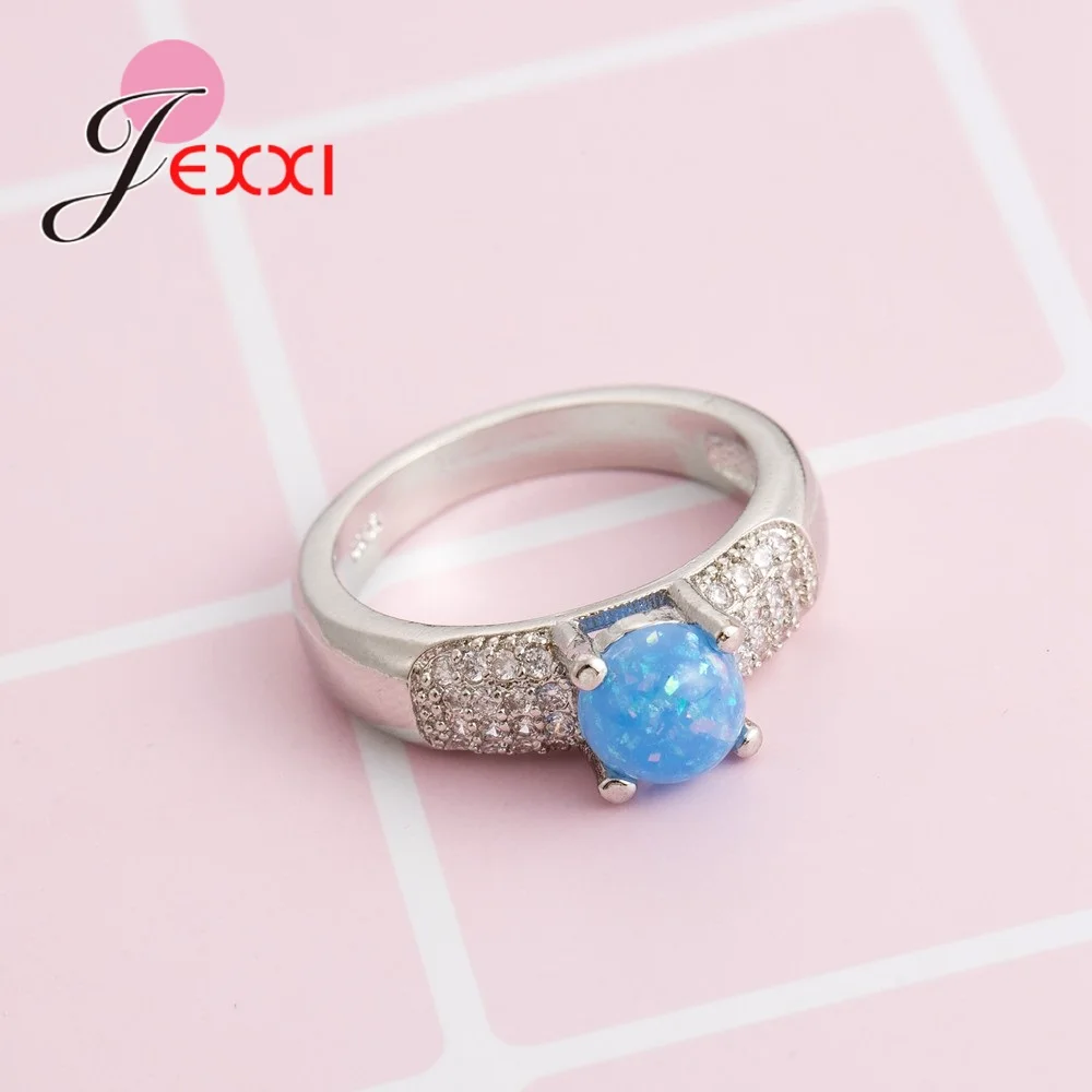 Женское ювелирное изделие с круглым опалом серебро 925 пробы