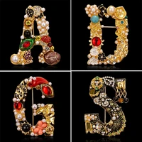 elegant 26 letters a d g s letter brooches for women rhinestone pearl enamel flower sweater scarf suit brooch pin female jewelry