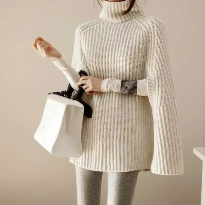 Фото Зимний женский вязаный свитер с высоким воротником свободный - купить