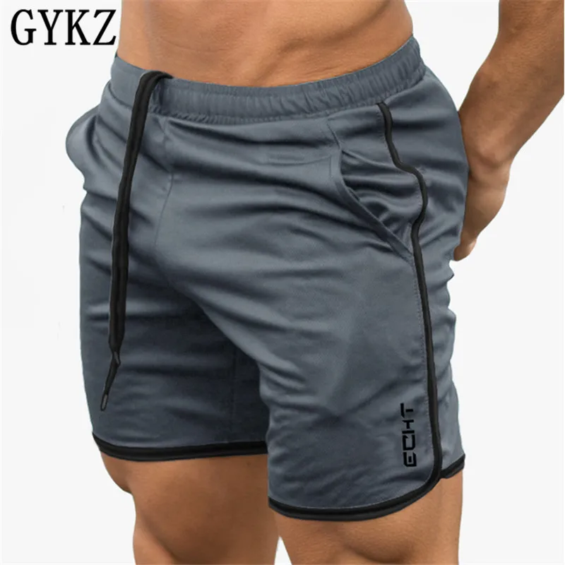 

Фирменные мужские спортивные шорты для бега GYKZ, мужские черные шорты для похудения, бодибилдинга, мужские шорты для фитнеса, тренажерного з...