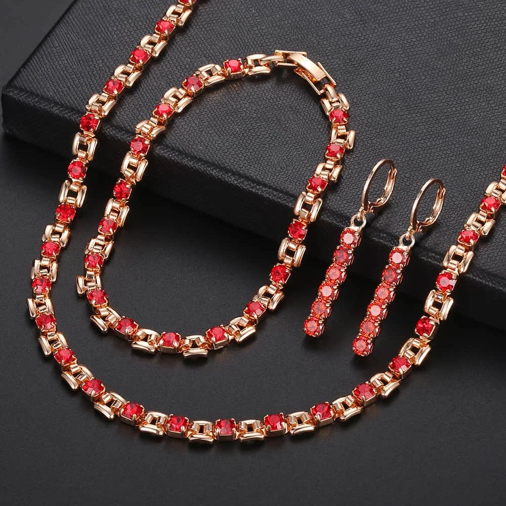 Женский комплект из браслета и сережек розового золота 585 пробы с прозрачным