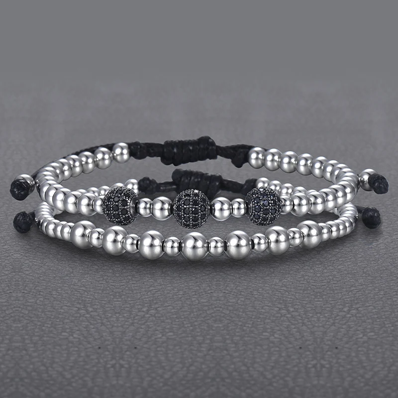 Набор из 2-х черных браслетов на мужскую руку с кубическим цирконием, бусинами из нержавеющей стали и растяжкой для удобства ношения, серебристого цвета. Товар доступен для дропшиппинга. (Перевод может незначительно отличаться в зависимости от контекста.)