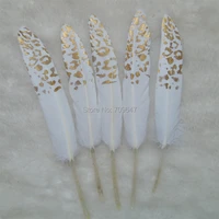 50pcslotthe white goose feathers with golden leopard painting unique feathers wedding feathers hat embellishment 9 15cmlong