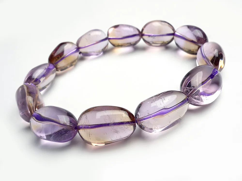 

Подлинная Natural Аметрин Gemstone 16 * 10 * 12 мм Фиолетовый Желтый овальный кристалл способа шарика ювелирных изделий Stretch браслет шарма Женский