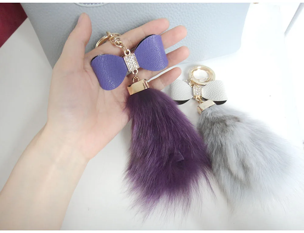 Кожаный брелок с бантом и меховым шариком аксессуар для сумки кристаллами