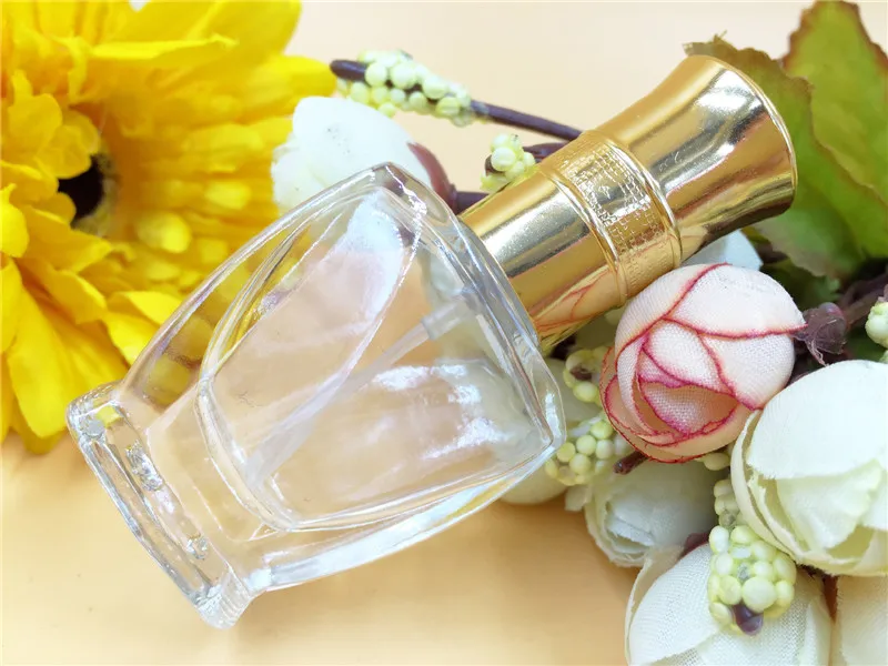 

100PCS 0.3 oz perfume bottles ,wholesale new chrysanthemum cover spray bottle , 10ml spray bottle transparent glass trapezoid