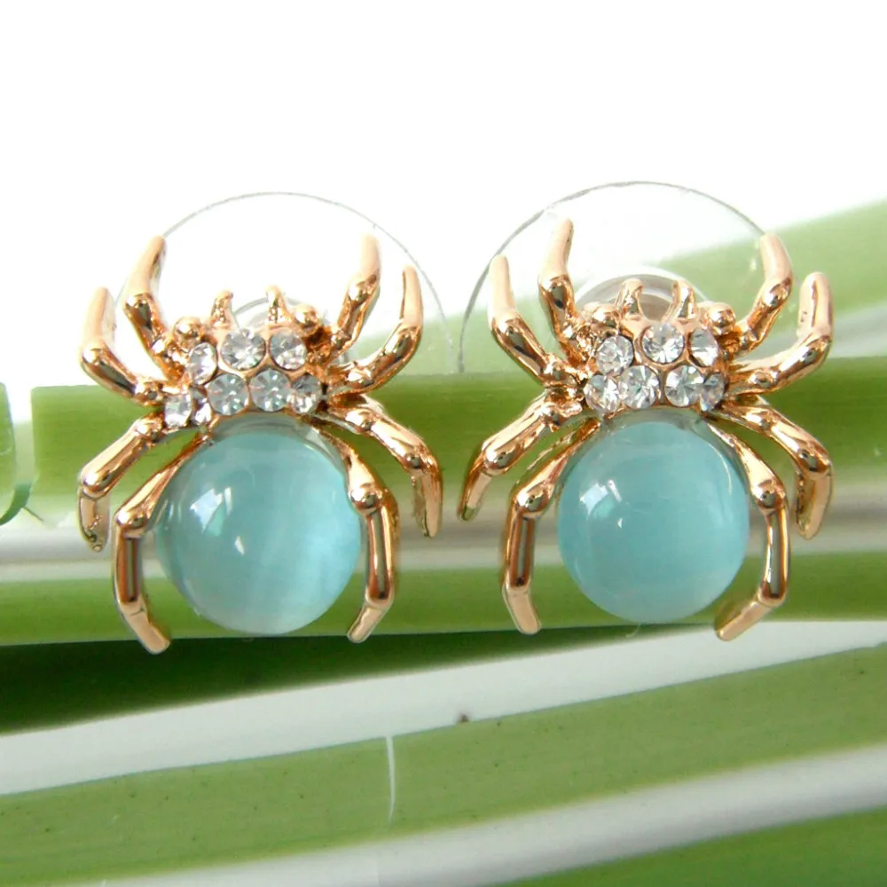 Серьги-гвоздики в форме паука тарантуса Navachi с голубым опалом и стразами SMT2402 |