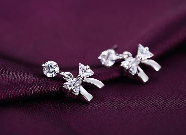 Женские посеребренные серьги-гвоздики с бантом Y | Украшения и аксессуары