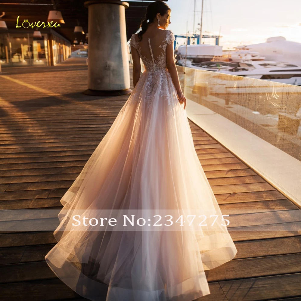 

Loverxu Sexy Illusion Scoop Neck Beach Wedding Dresses 2019 Elegant Appliques Sweep Train Cap Sleeve Tulle Vintage Bridal Gowns