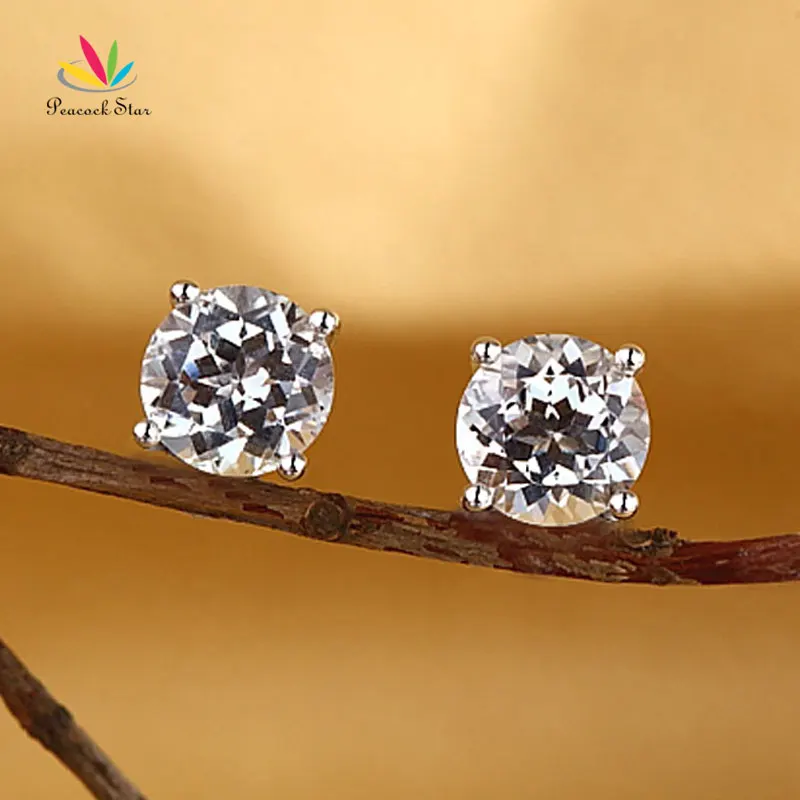 Серьги гвоздики из белого золота 14 к с павлиньими звездами натуральный чистый