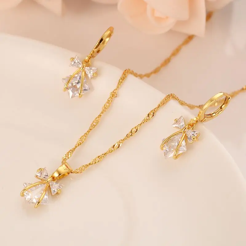 Набор ювелирных изделий серьги с бантом и белым кристаллом из кубического