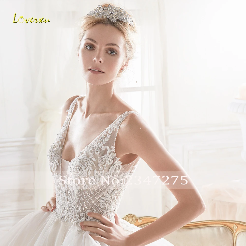

Loverxu Vestido De Noiva Sexy Backless Princess Wedding Dresses 2019 Luxury V Neck Chapel Train Beaded Tiered A Line Bridal Gown