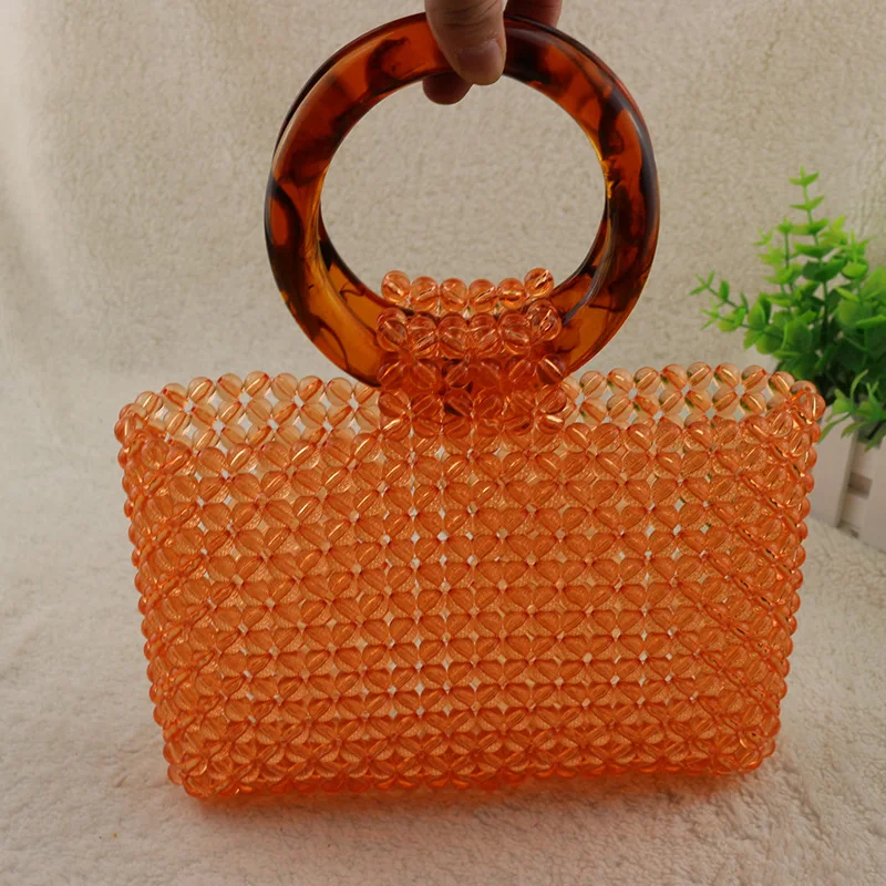 

Portable Round Fish Line Beaded Acrylic Polished Transparent Orange Beads High-end Bag