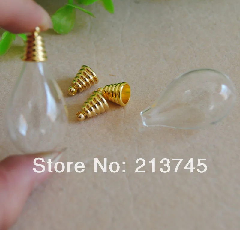 

Free ship!!!good 50set/lot round 31*18mm glass globe bubble with glod cap set DIY (glass cover bottle vial pendant )