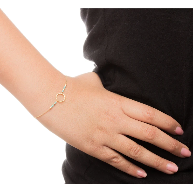 Браслет со сверкающими зелеными бусинами из семян кармы золотистый мерцающий