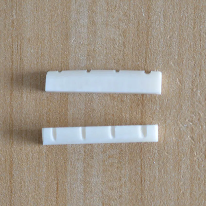 Оптовая продажа 10 шт. 6 мм щелевые басовые гайки с реальной костью 4 струны для