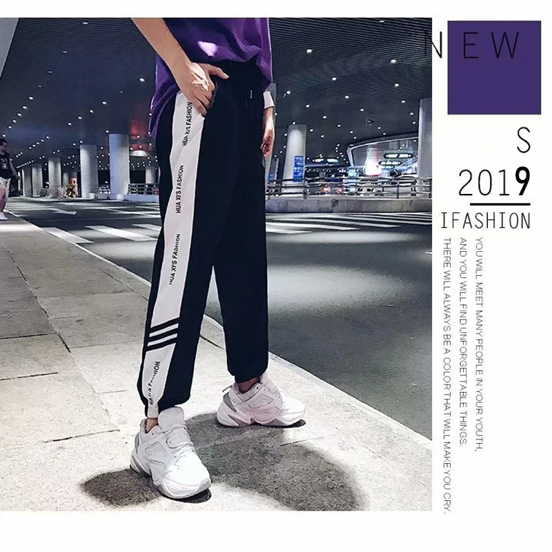 Брюки женские черные в полоску сбоку с эластичным поясом осень 2019 повседневные