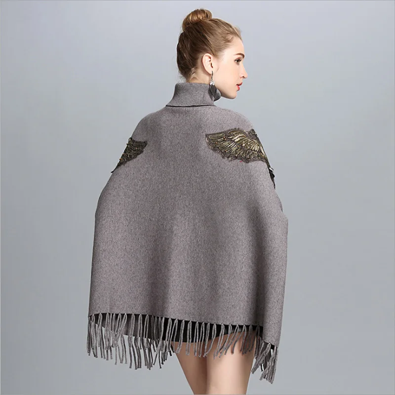 ZDFURS* Autumn Winter Long Knitted Women Eagle Appliqued Sweater Fashion Long Batwing Sleeves High Neck Stole Tassel Poncho