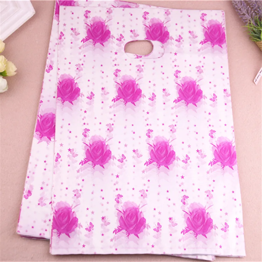 

New Design Wholesale 100pcs/lot 25*35cm Hot Pink Warmly Rose Casamento Gift Packaging Bags With Handles Large Plastic Bag