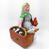 vintage peasant woman carrying a basket luggage model wind up clockwork tin toy collectible gift for kidsadult