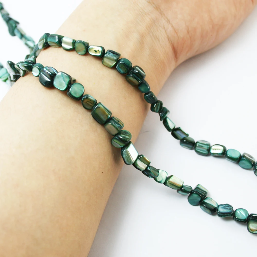 Бисер в виде раковины павлина зеленого цвета 5-7 мм длина 37 см (приблизительно 50