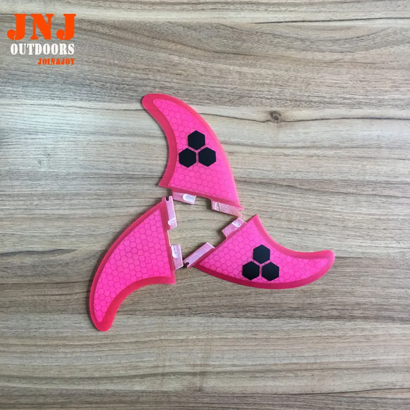 

pink perfect fit FCS II fins made of resin and fiberglass honeycomb for surfing 002 size M