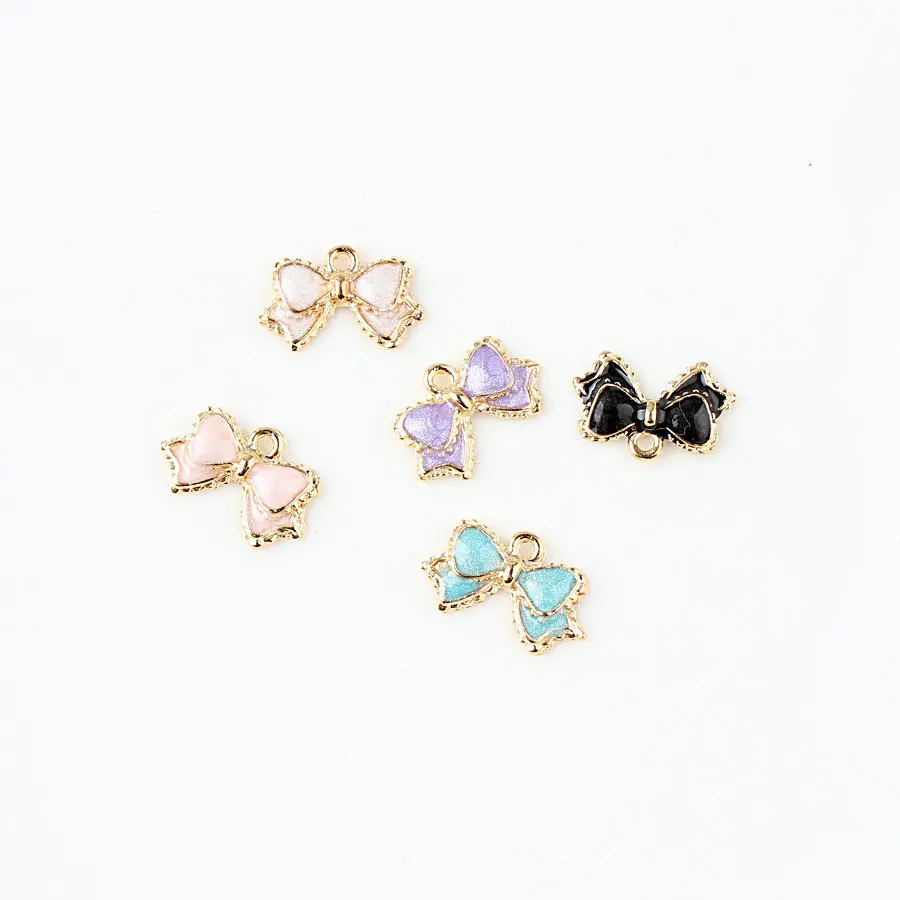 

Free shipping Alloy drop oil 50pcs mix colour gold color metal Ribbons bowknot shape charms for necklace jewelry making