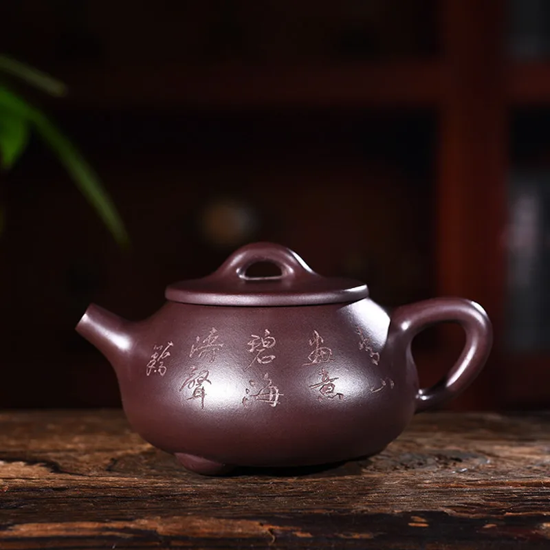 

Yixing purple clay pot genuine hand-made raw ore old Purple mud engraved landscape stone ladle pot Kungfu Teapot Tea Set