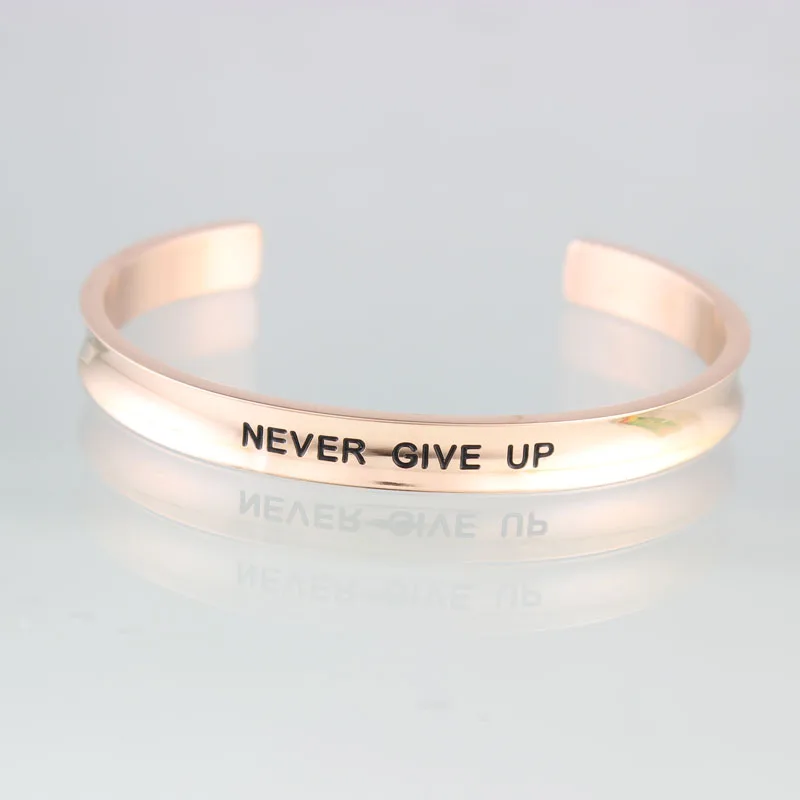 Никогда не сдается нержавеющая сталь на заказ Выгравированный положительный