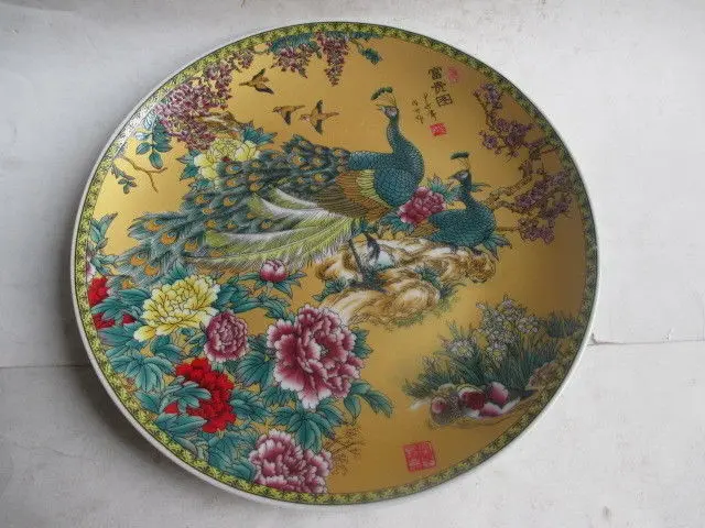 

China's rich and colorful handmade ceramic painting board by the peacock