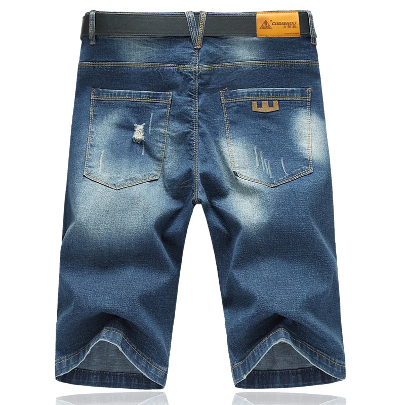 

Free shipping male denim capris personality hole jeans plus size casual shorts summer loose straight short trousers size 48