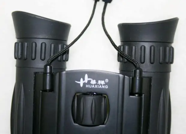 High quality Huaxiang 12x32 binoculars HD portable telescope 87m / 1000m optics Hunting Concert wide viewpoint Free ShippingRK76 |