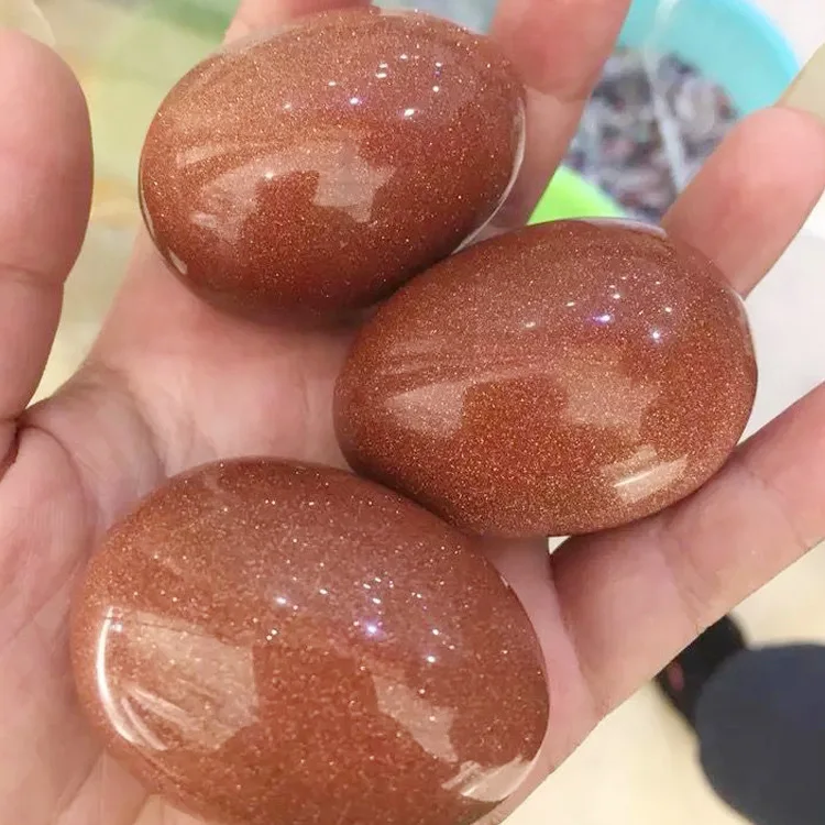 

High-quality natural quartz crystal gold sand stone egg red star stone. 1pcs