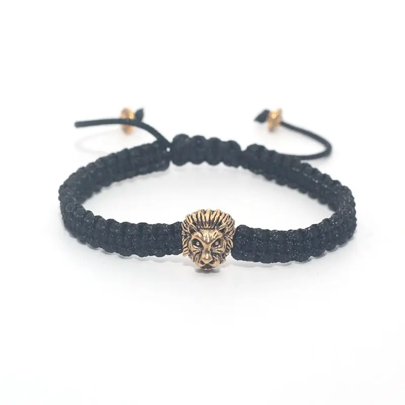 Мужской браслет макраме из черного веречка с серебряным и золотым черепом львом